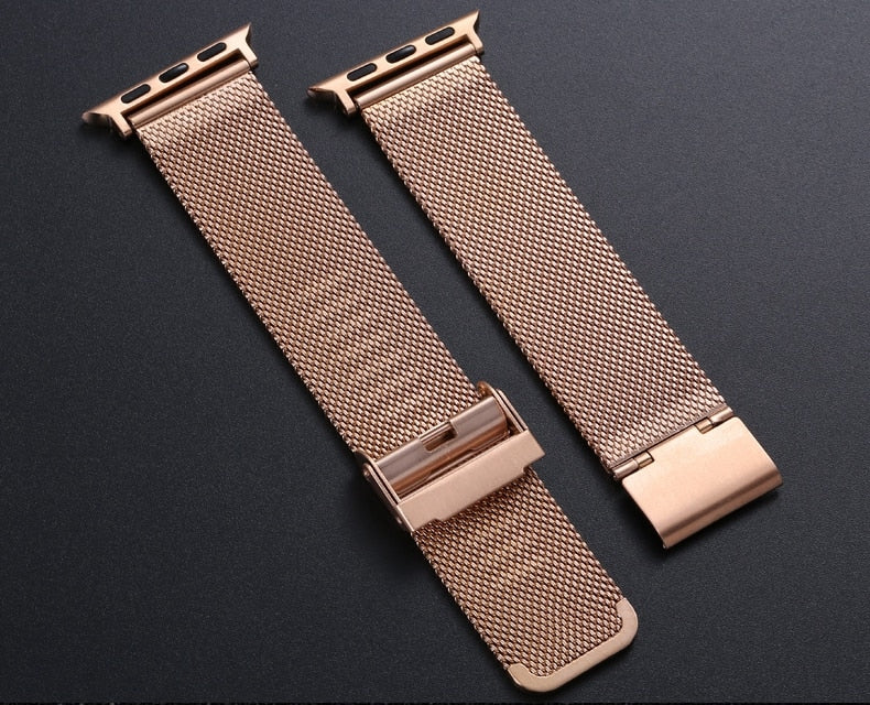 Rose gold Milanese mesh Apple Watch bands with magnetic clasp connector, pair displayed on dark background