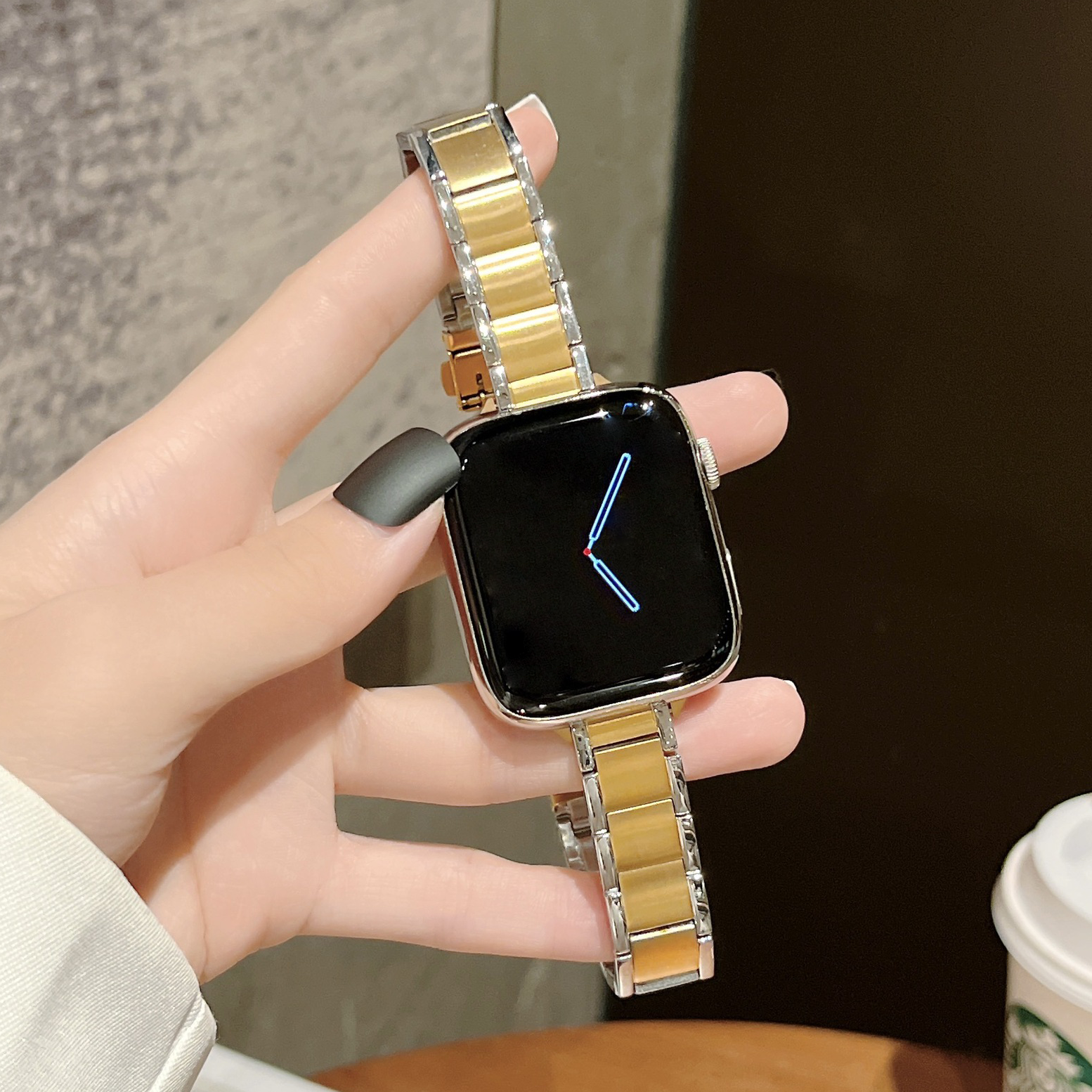 Luxury two-tone gold and silver stainless steel bracelet band for Apple Watch with square face smartwatch display showing time
