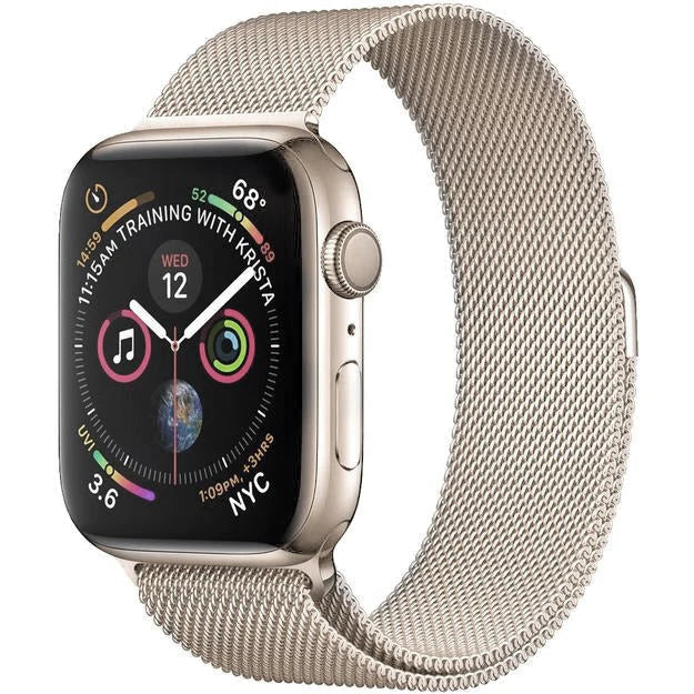 Apple Watch Series 4 with starlight Milanese Loop band showing fitness tracking complications and digital time display
