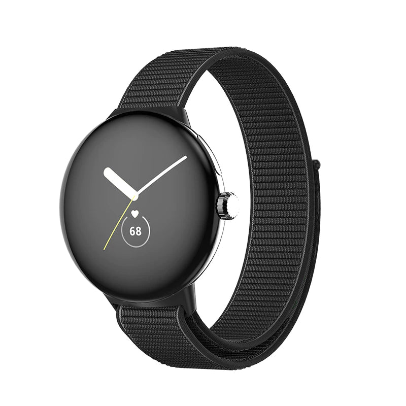 Black Pixel Watch with sports loop velcro band, displaying heart rate monitor and time on AMOLED screen