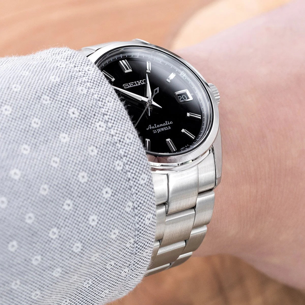Seiko SARB033 automatic watch with stainless steel Super-O Boyer bracelet on wrist, black dial with date window