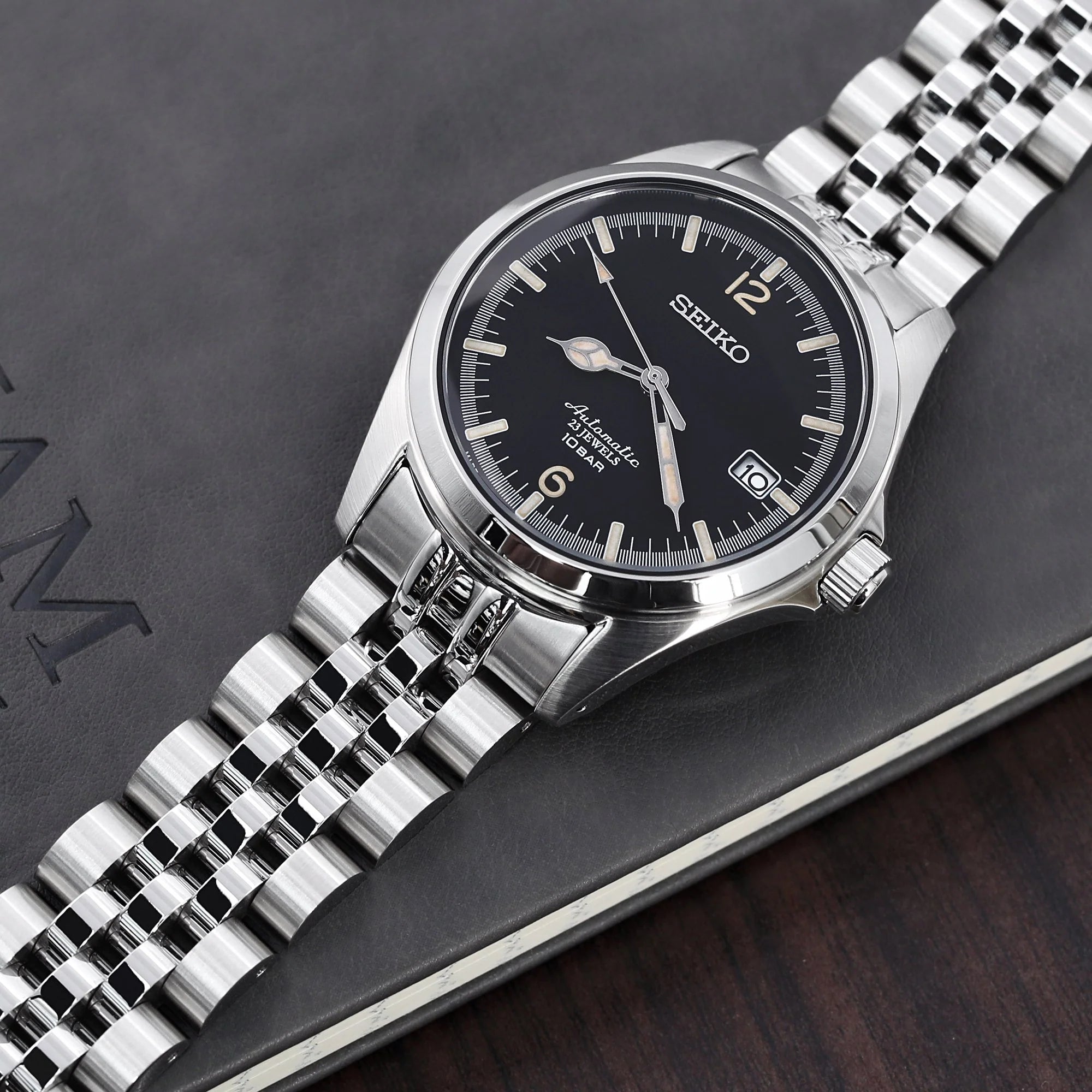 Seiko SARB033 automatic watch with stainless steel Angus-J Jub Louis bracelet on dark background