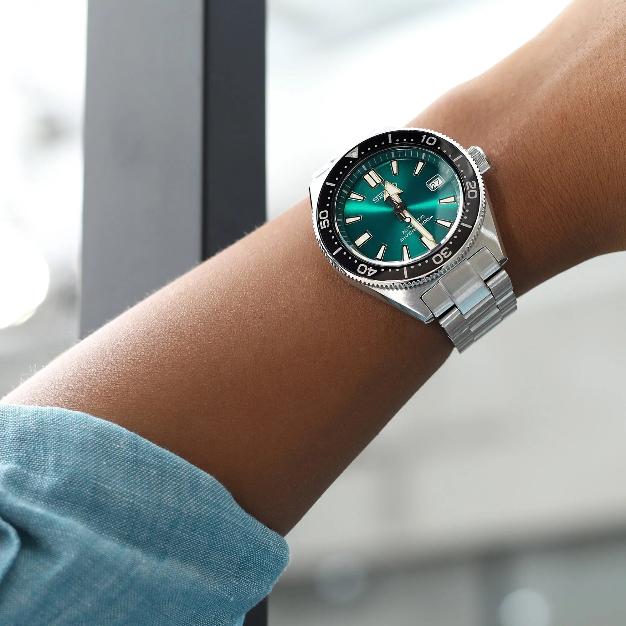 Strapcode Super-O Boyer bracelet on Seiko SBDC053 62MAS dive watch with teal dial and black bezel, worn on wrist