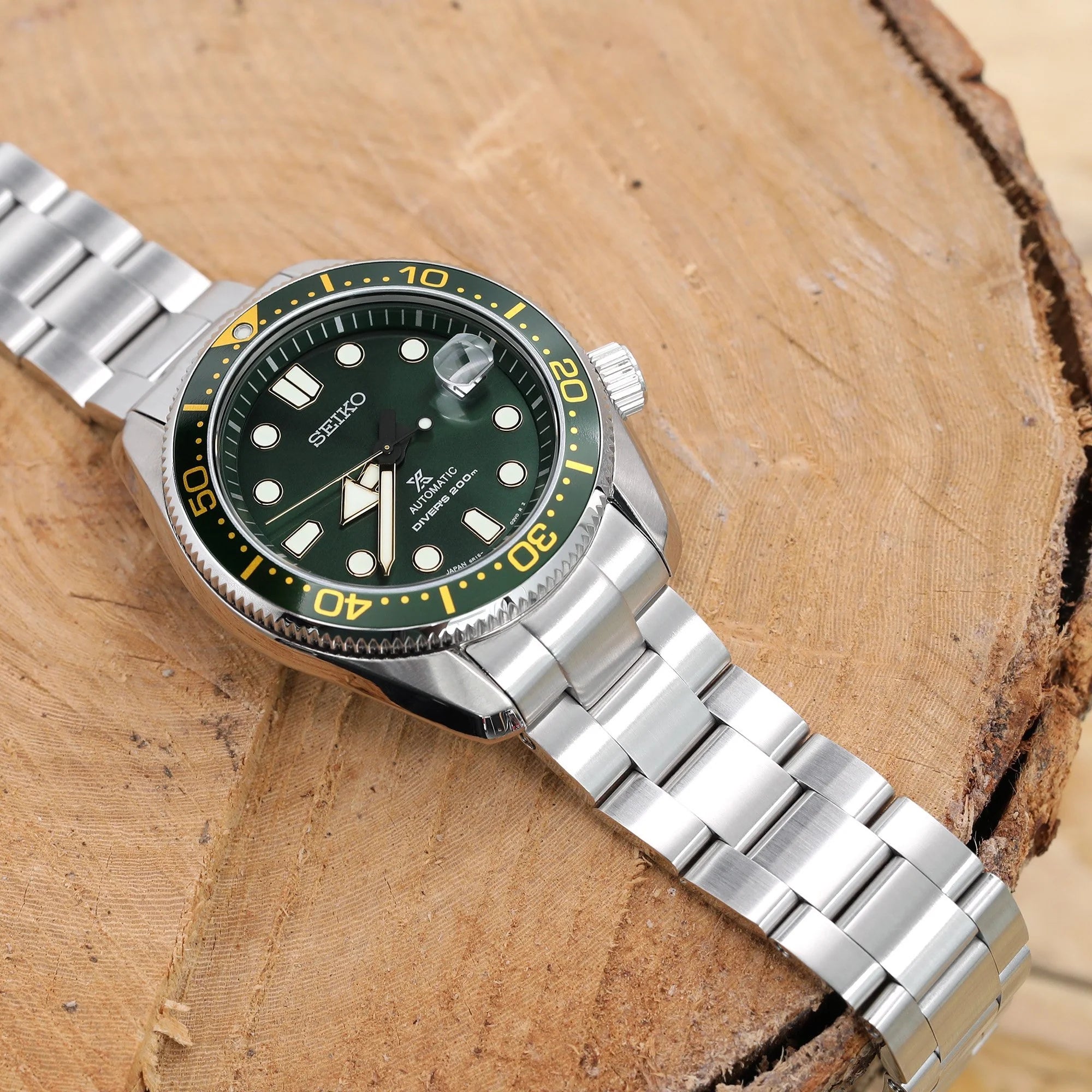 Seiko Baby MarineMaster MM200 dive watch with green dial and yellow bezel on stainless steel Super-O Boyer bracelet