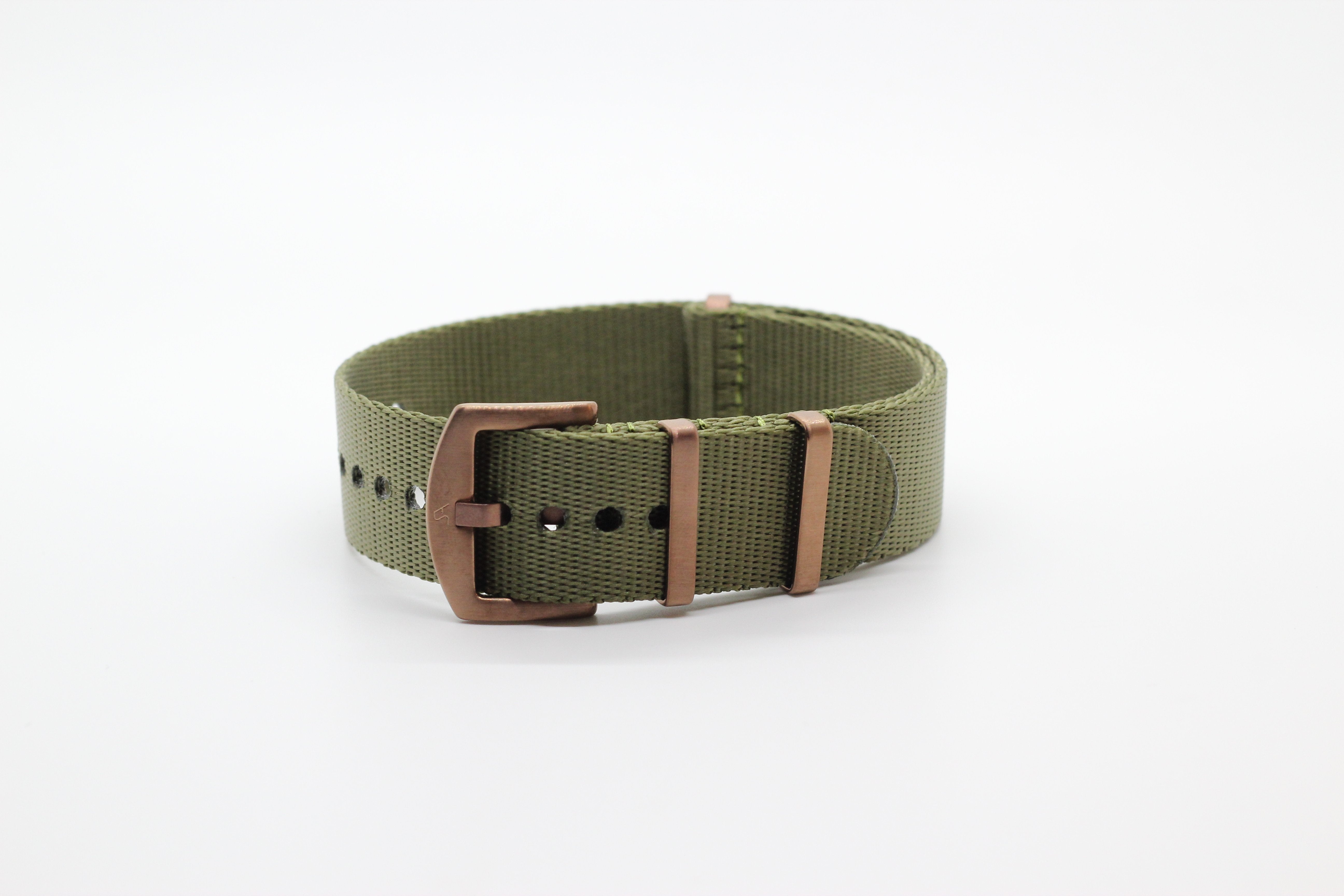 Army green fabric watch strap with bronze buckle and hardware closure