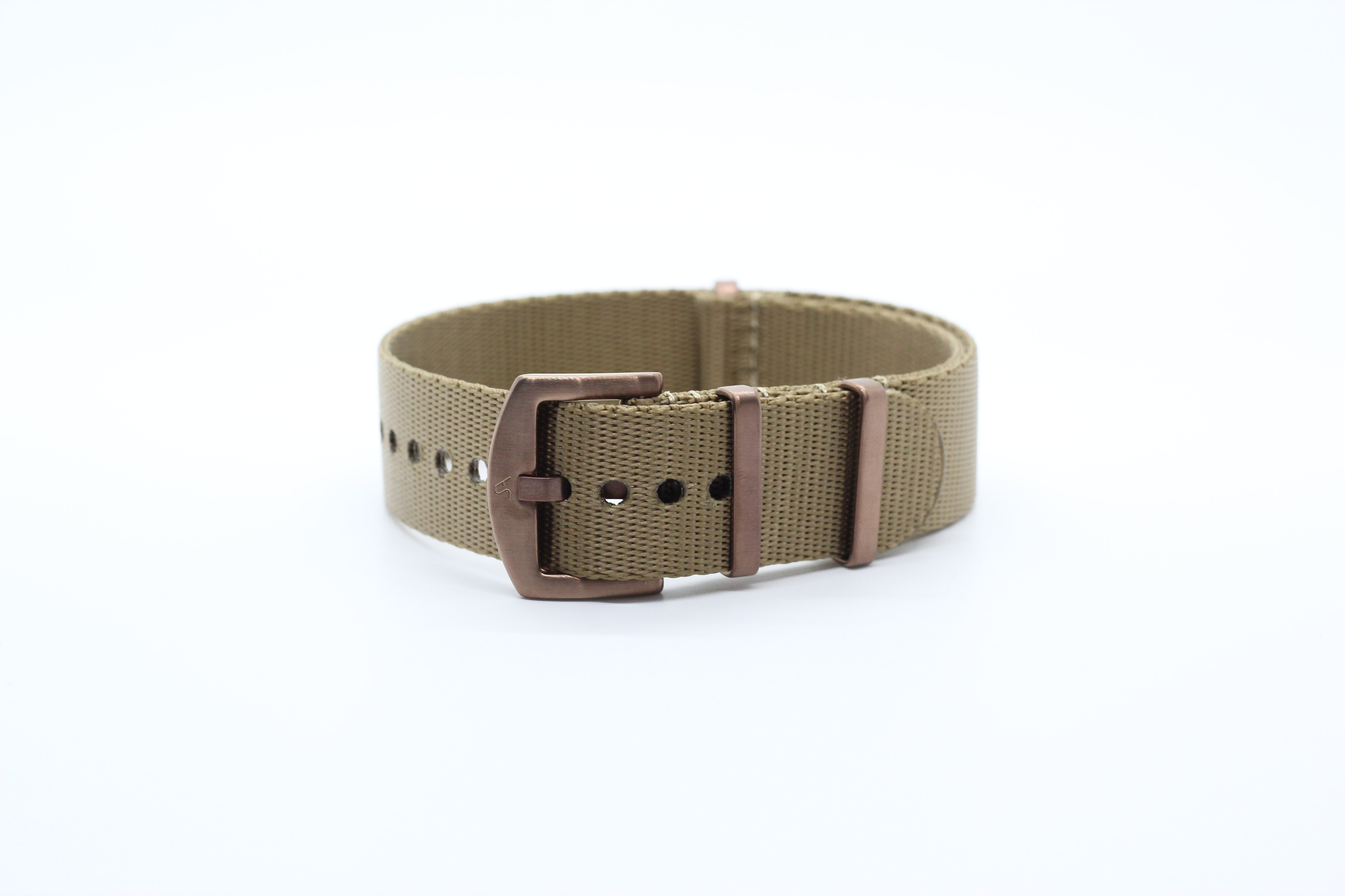 Beige canvas watch strap with bronze buckle and keepers, military-style design isolated on white background