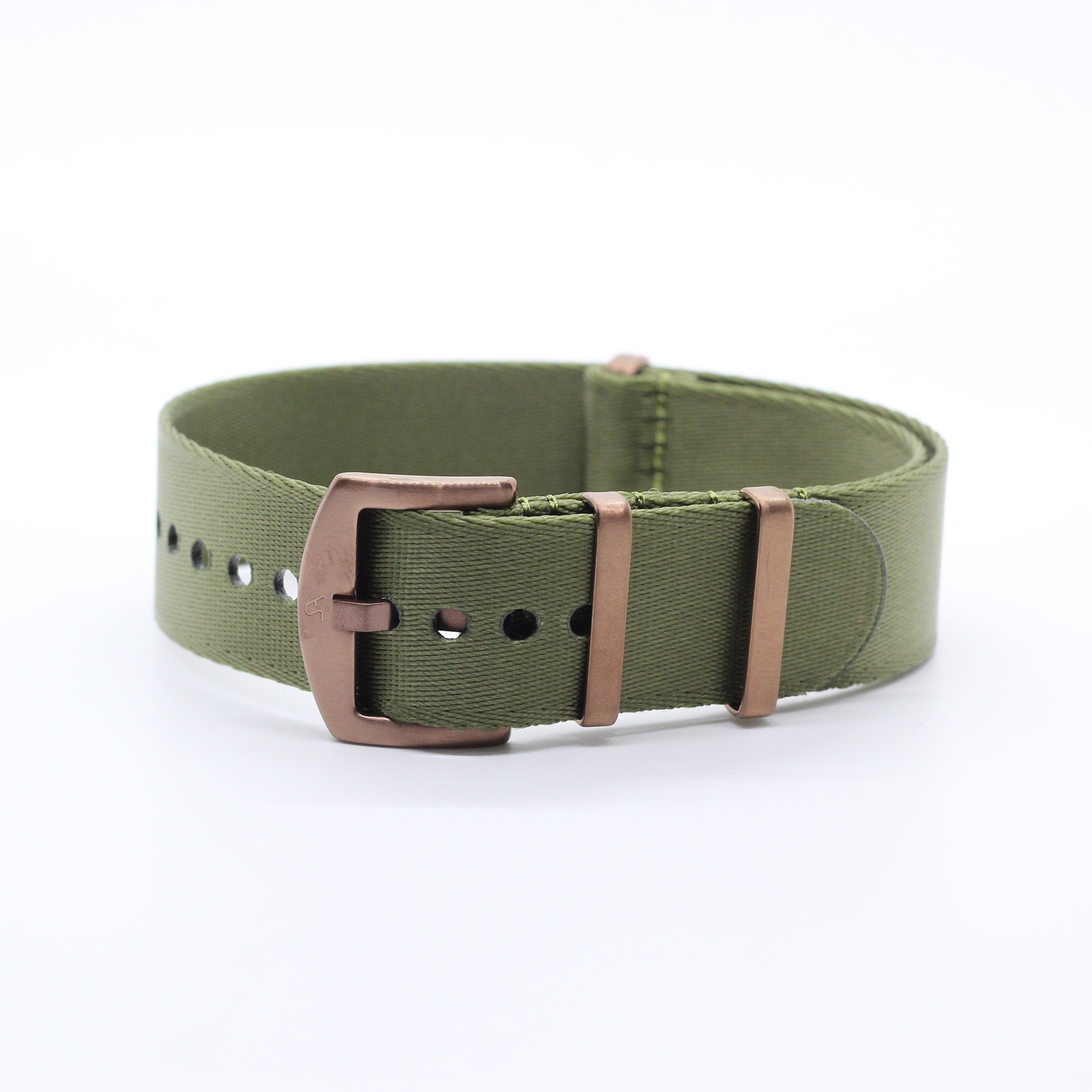 Olive green canvas watch strap with bronze metal buckle and hardware, military style band on white background