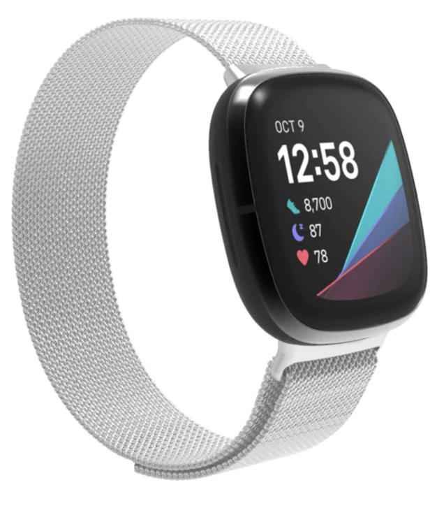 Fitbit Versa smartwatch with silver Milanese mesh band displaying time, steps, and heart rate metrics