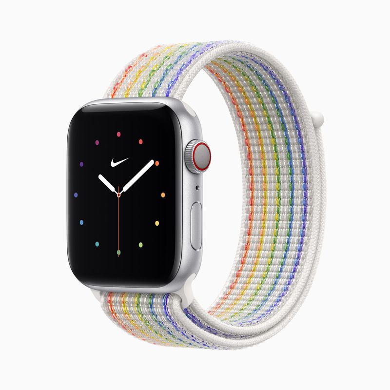 Silver Apple Watch with rainbow striped woven sports loop band, colorful clock face with Nike logo