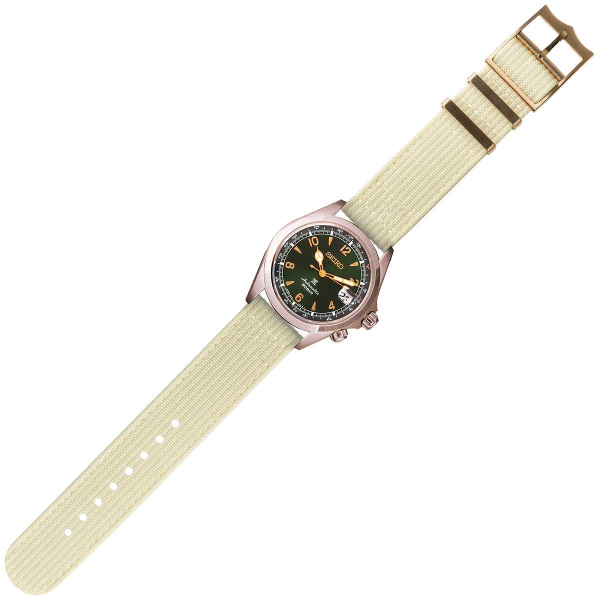 Seiko automatic watch with black dial, gold accents, and beige fabric quick-release strap with bronze buckle