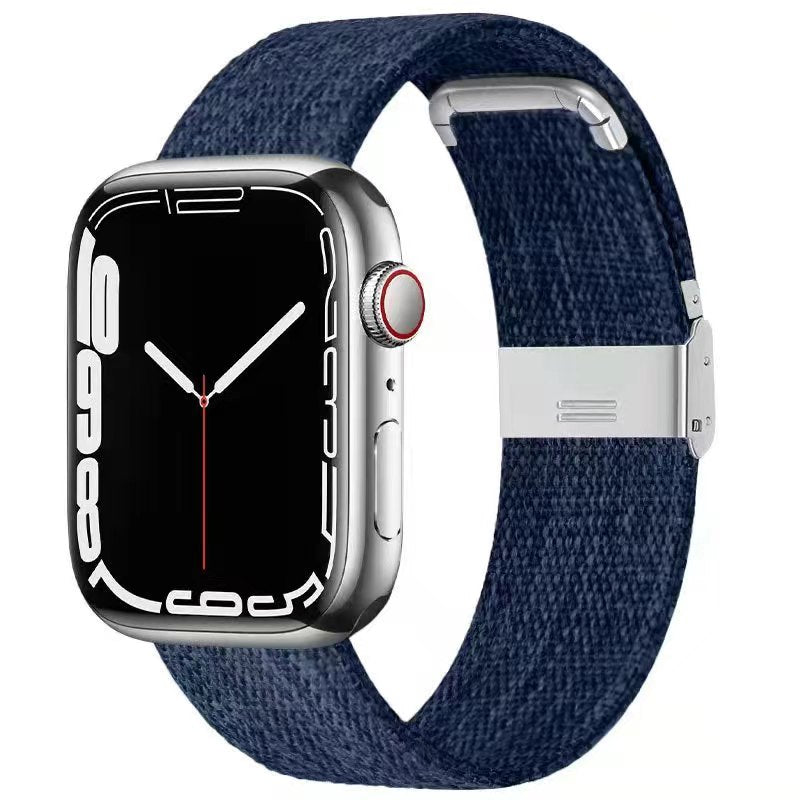 Silver stainless steel smartwatch with navy blue canvas band and magnetic clasp closure