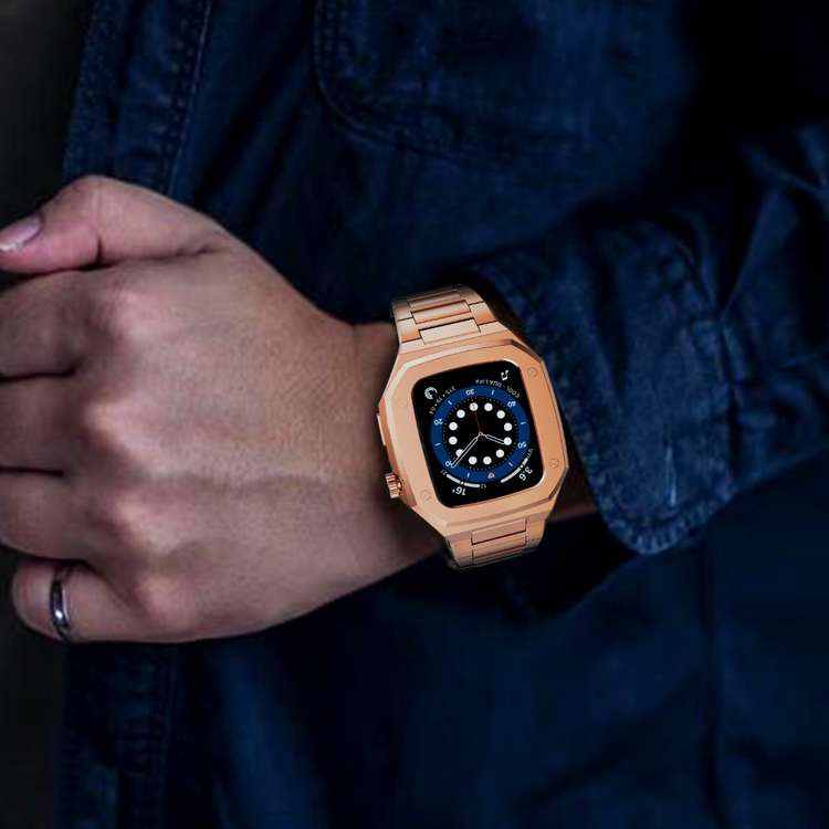 Rose gold stainless steel Apple Watch with matching bracelet and blue digital dial on wrist