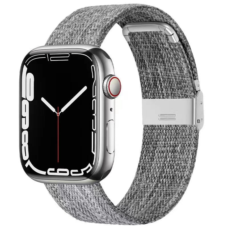 Silver stainless steel smartwatch with gray woven canvas band and magnetic clasp closure