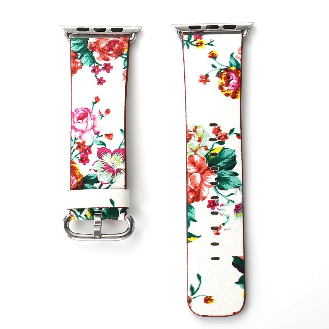 Floral leather Apple Watch band with vibrant multicolored flowers on white background and silver connector hardware