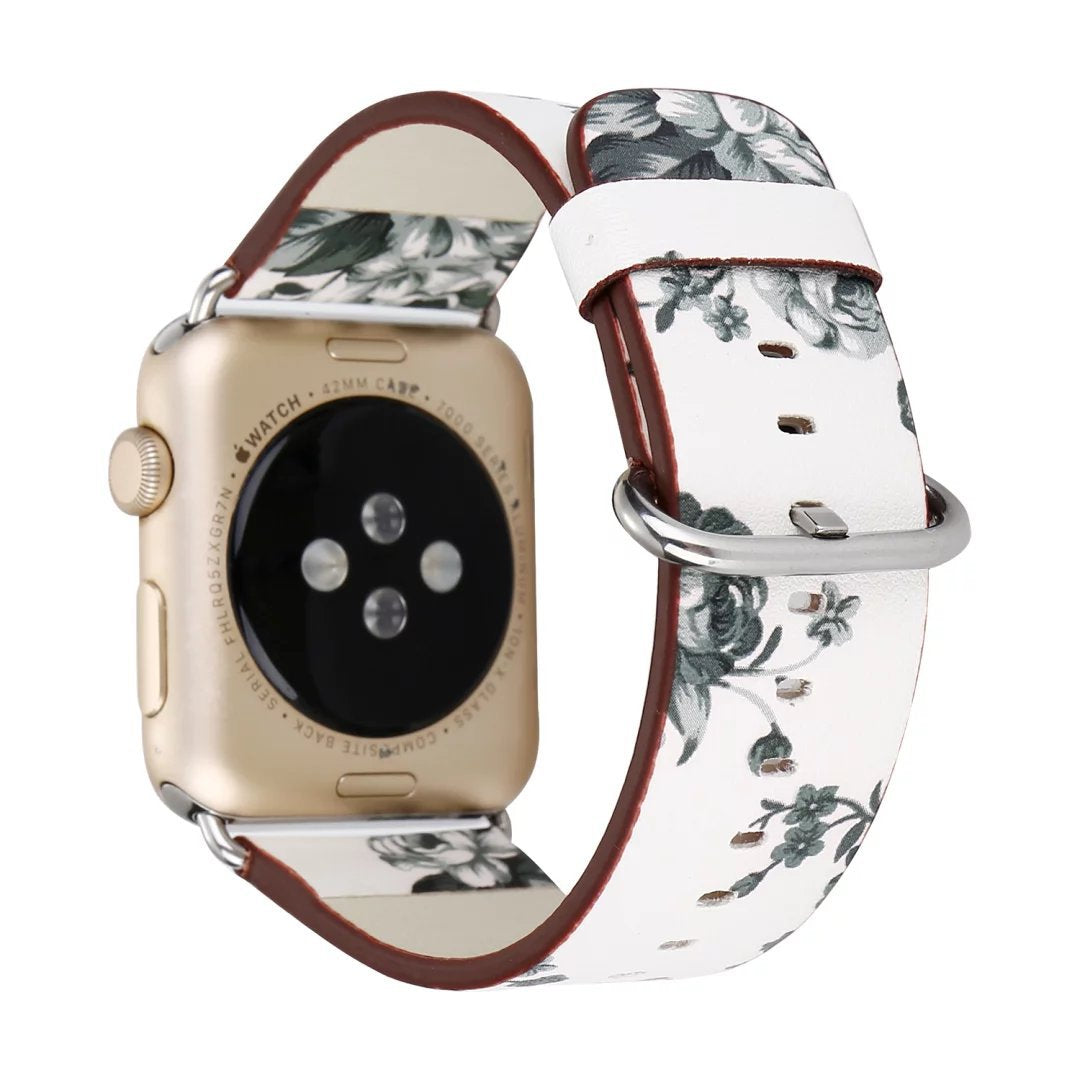 Gold smartwatch with cream floral leather band featuring green rose print and burgundy interior lining