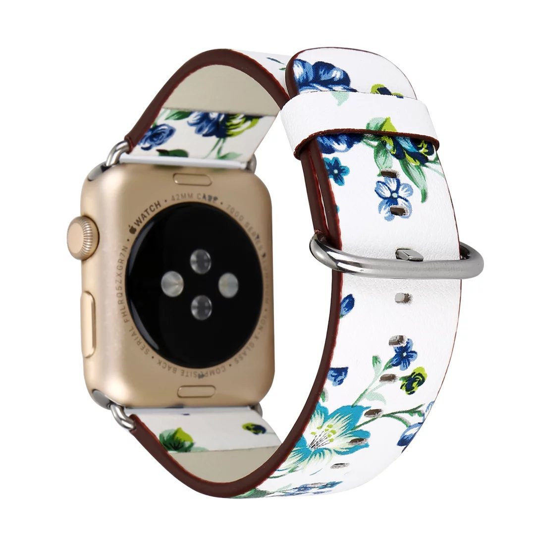 Gold smartwatch with floral blue and green printed white leather band featuring burgundy leather trim and silver buckle
