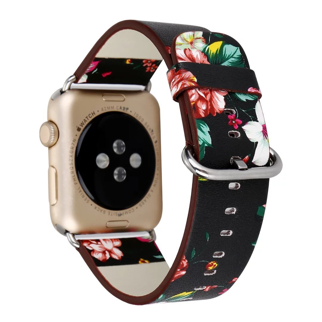 Gold smartwatch with floral leather band featuring red roses and green leaves on black background with burgundy accents