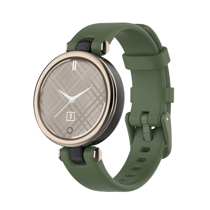 Garmin Lily smartwatch with sage green silicone band and quilted gray dial face