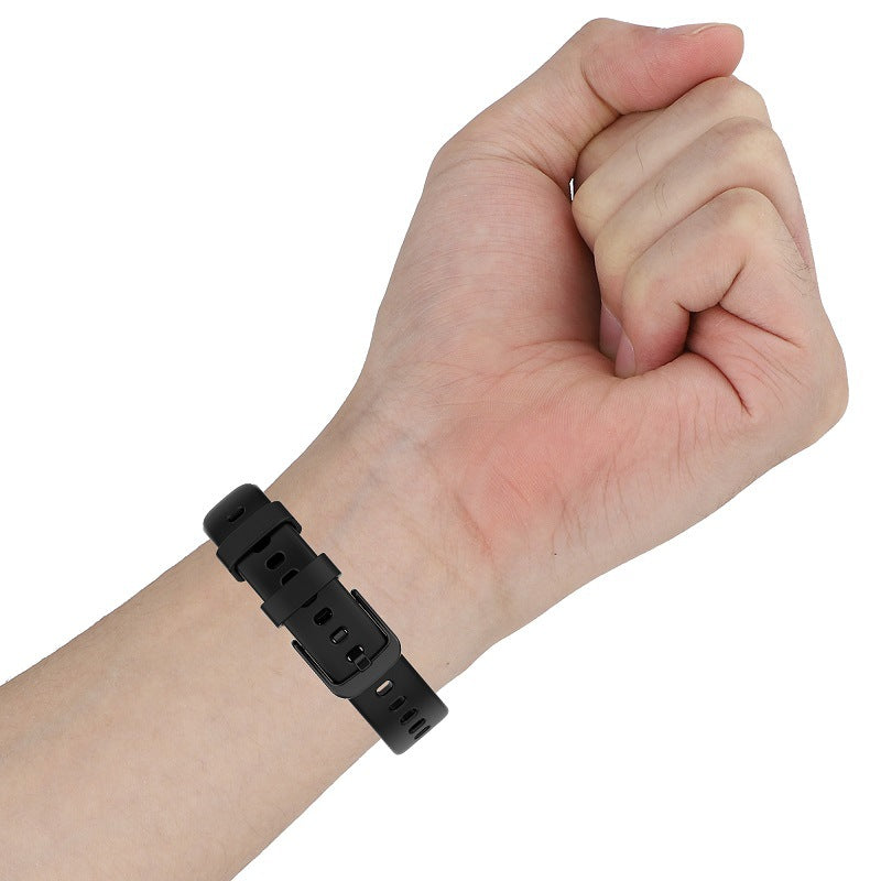 Black silicone sports watch band worn on wrist, flexible adjustable strap for Garmin Lily smartwatch