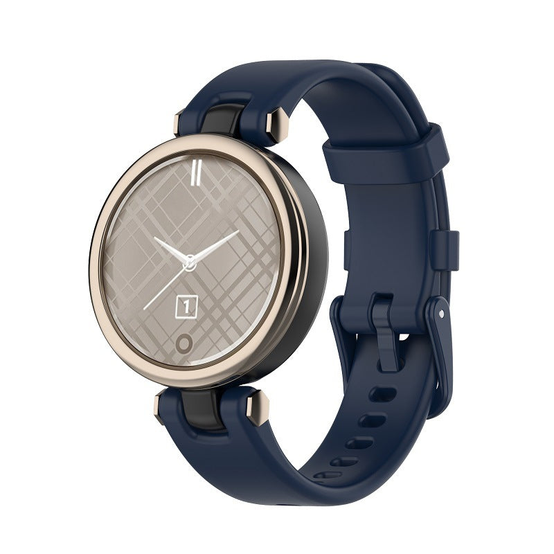 Garmin Lily smartwatch with champagne gold case, quilted gray dial and navy blue silicone band