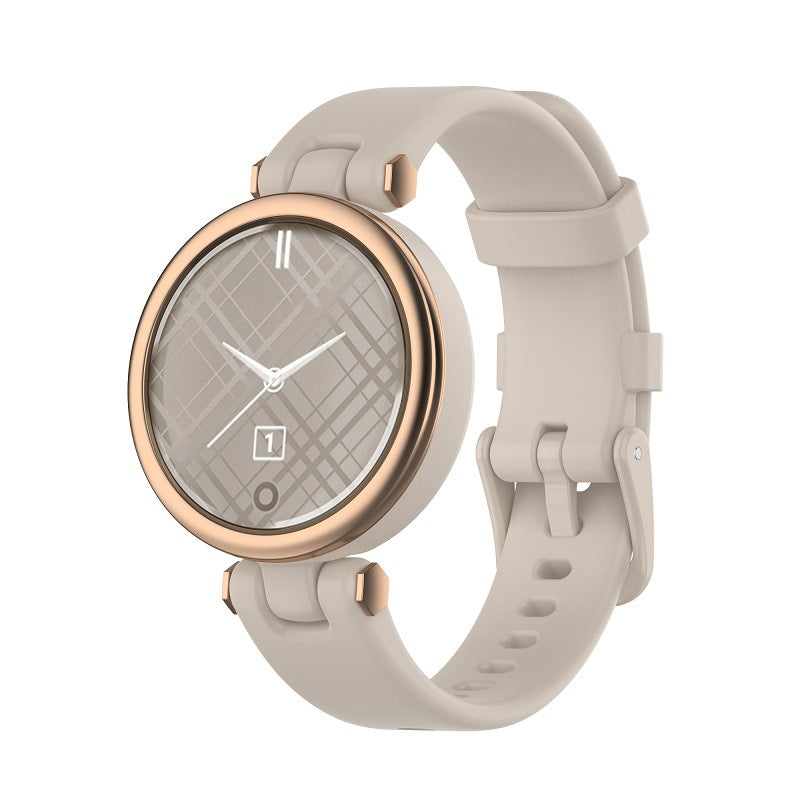 Garmin Lily smartwatch with rose gold case, quilted gray silicone band, and analog dial display