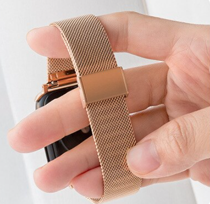 Rose gold Milanese mesh band with magnetic clasp for Apple Watch, displayed on wrist