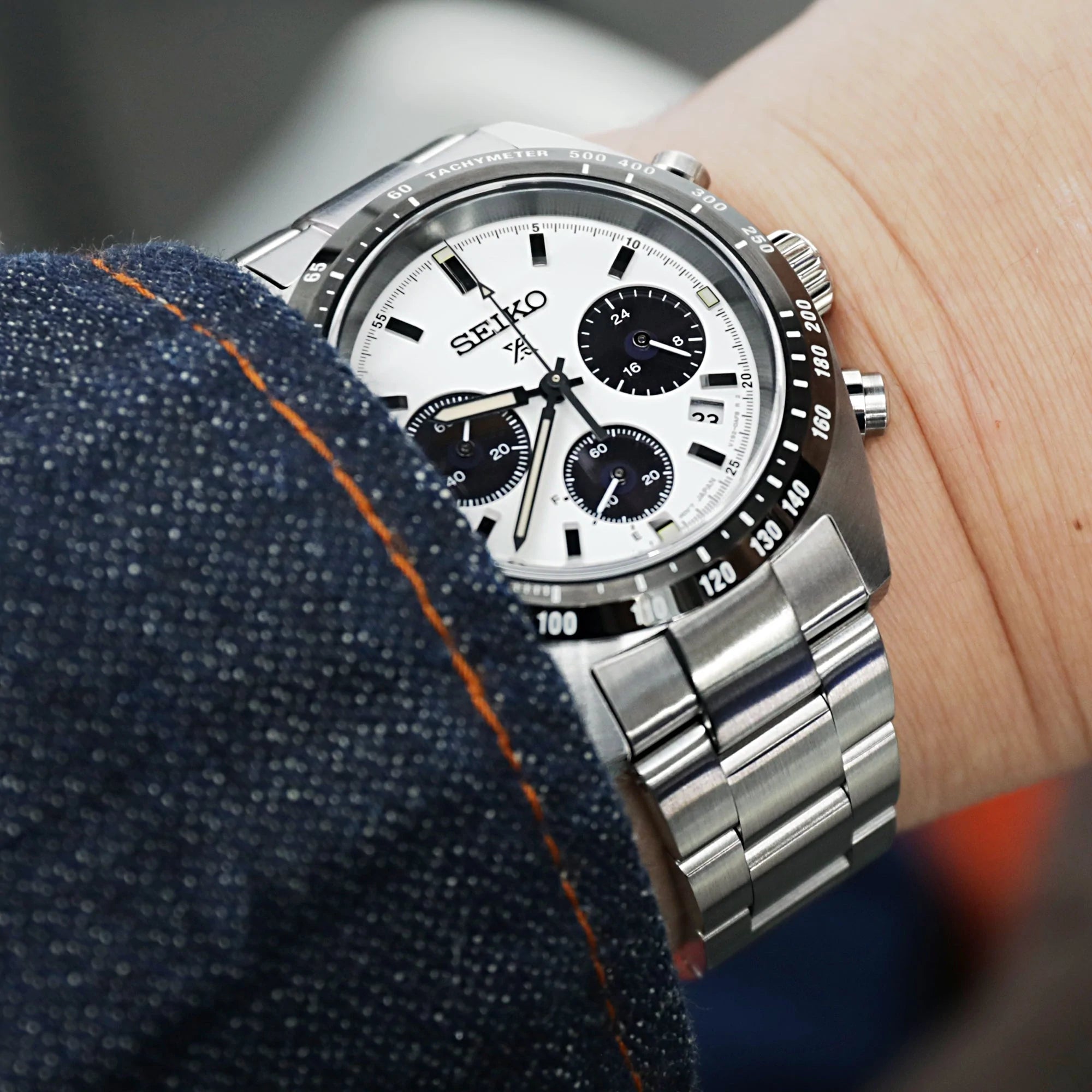 Seiko Speedtimer SSC813 chronograph watch with white dial and black subdials on stainless steel Super-O Boyer bracelet, worn on wrist