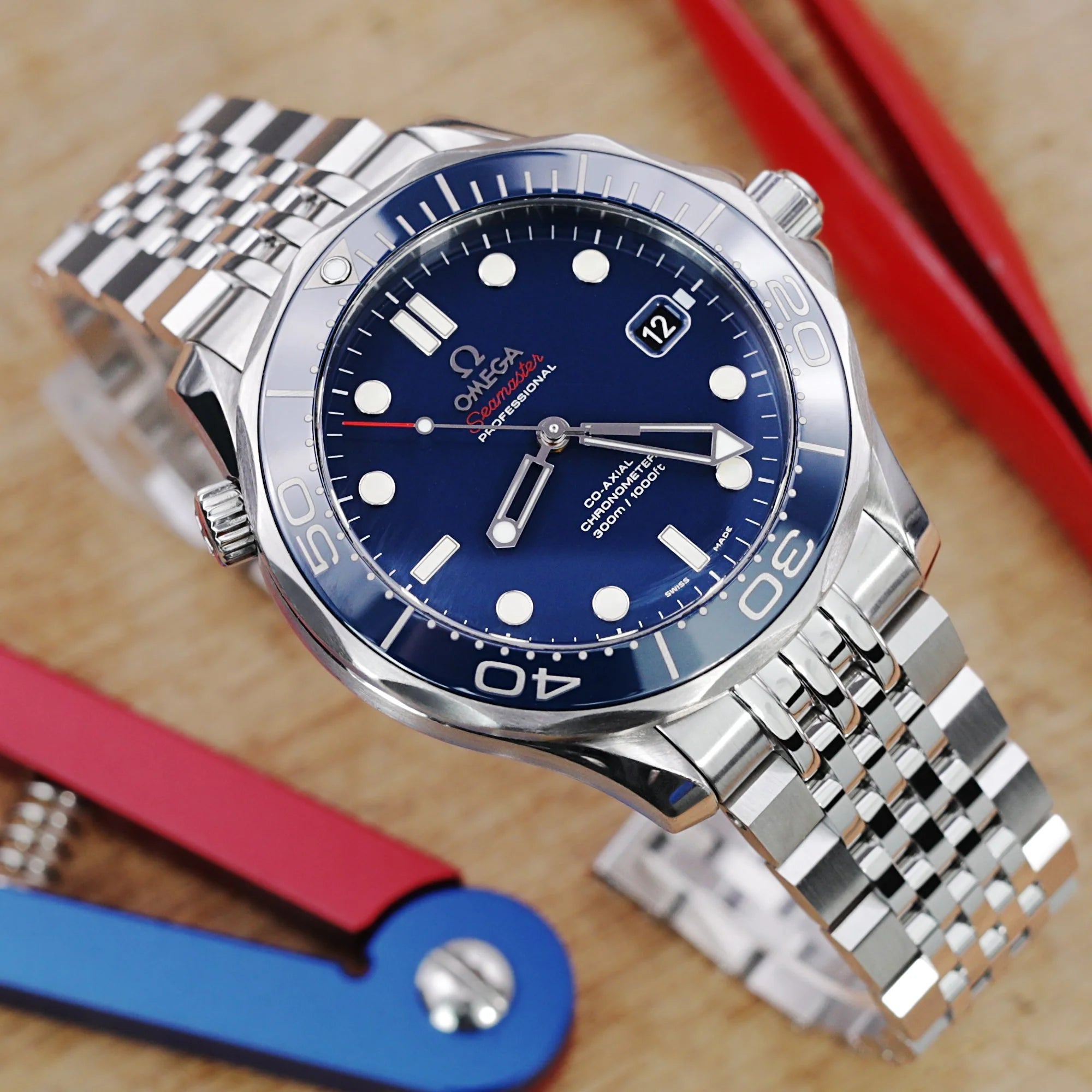 Stainless steel Asteroid bracelet fitted on Omega Seamaster 41mm watch with blue dial and metal jubilee band
