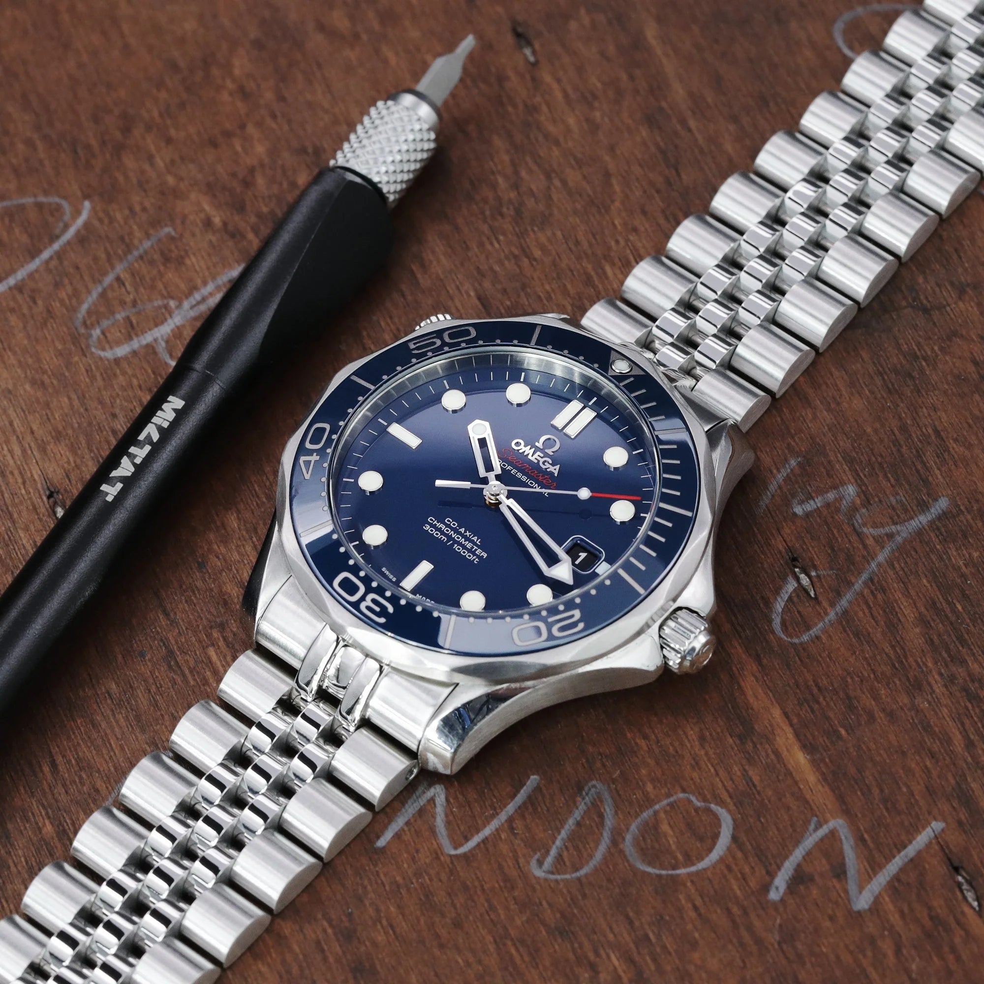 Strapcode Super-J Louis stainless steel bracelet for Omega Seamaster 41mm and Moonswatch 20mm fitted on blue dial watch