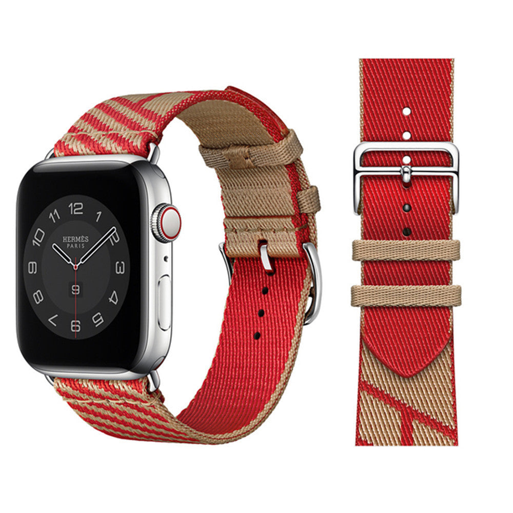 Hermès Apple Watch with red and tan woven textile single tour band and silver stainless steel case