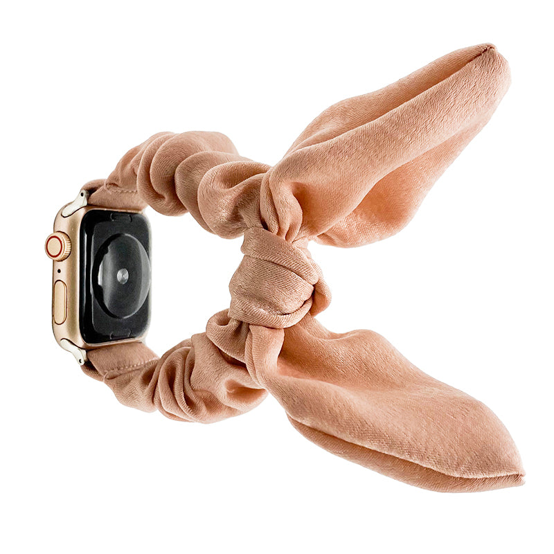 Beige fabric scrunchie loop Apple Watch band with draped ribbon design and gold accent ring detail