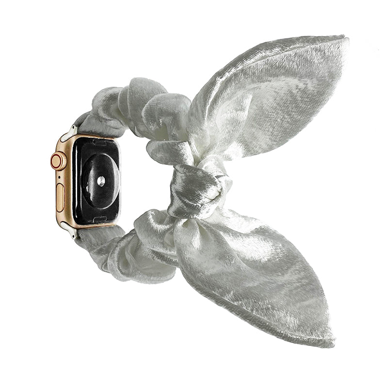 Gold stainless steel smartwatch with silver silk ribbon loop band against white background