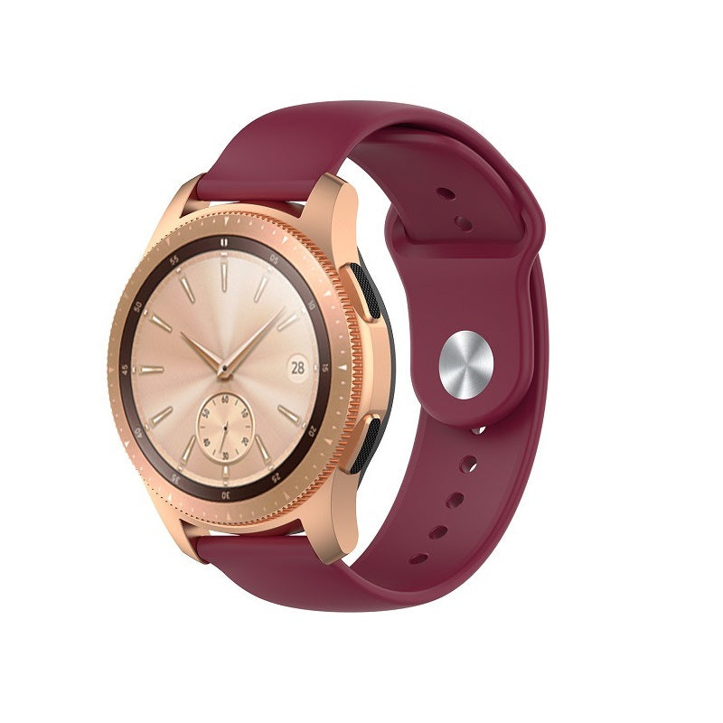 Rose gold smartwatch with burgundy silicone loop band and quick release mechanism, isolated on white background