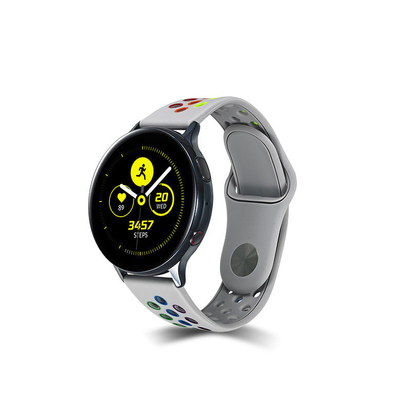 Black smartwatch with gray silicone sports band featuring colorful pattern, displaying fitness tracking data and 3457 steps on AMOLED screen