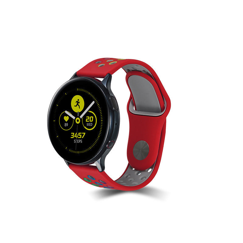 Black smartwatch with red and gray sports silicone band, displaying fitness tracking data and step counter on AMOLED screen
