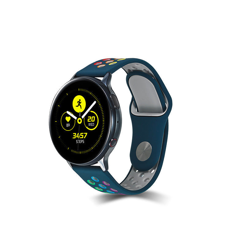 Blue and gray silicone sports watch band with rainbow design, displaying fitness tracking interface with step counter and workout metrics on AMOLED screen
