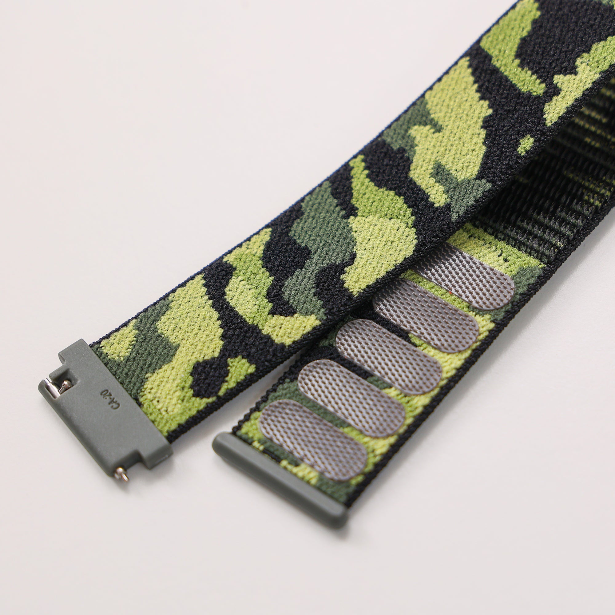 Army camo quick release sports loop velcro strap with gray plastic buckle and woven textile pattern