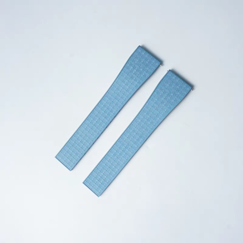 Pair of blue FKM rubber watch straps with textured mosaic pattern and quick release 16mm connectors for leaf-spring deployant clasp