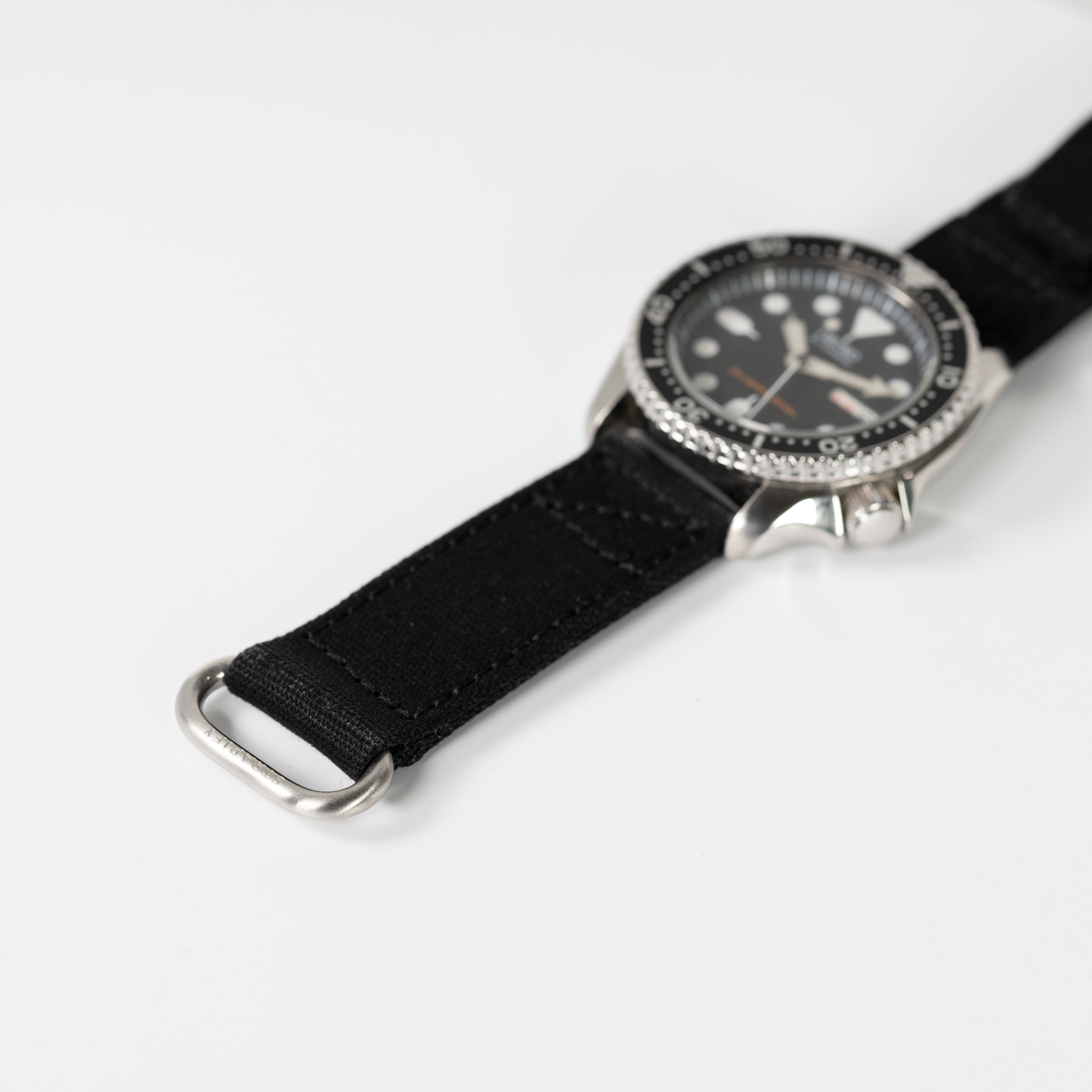 Black fabric military watch strap with quick release and velcro fastening system for tactical timepiece