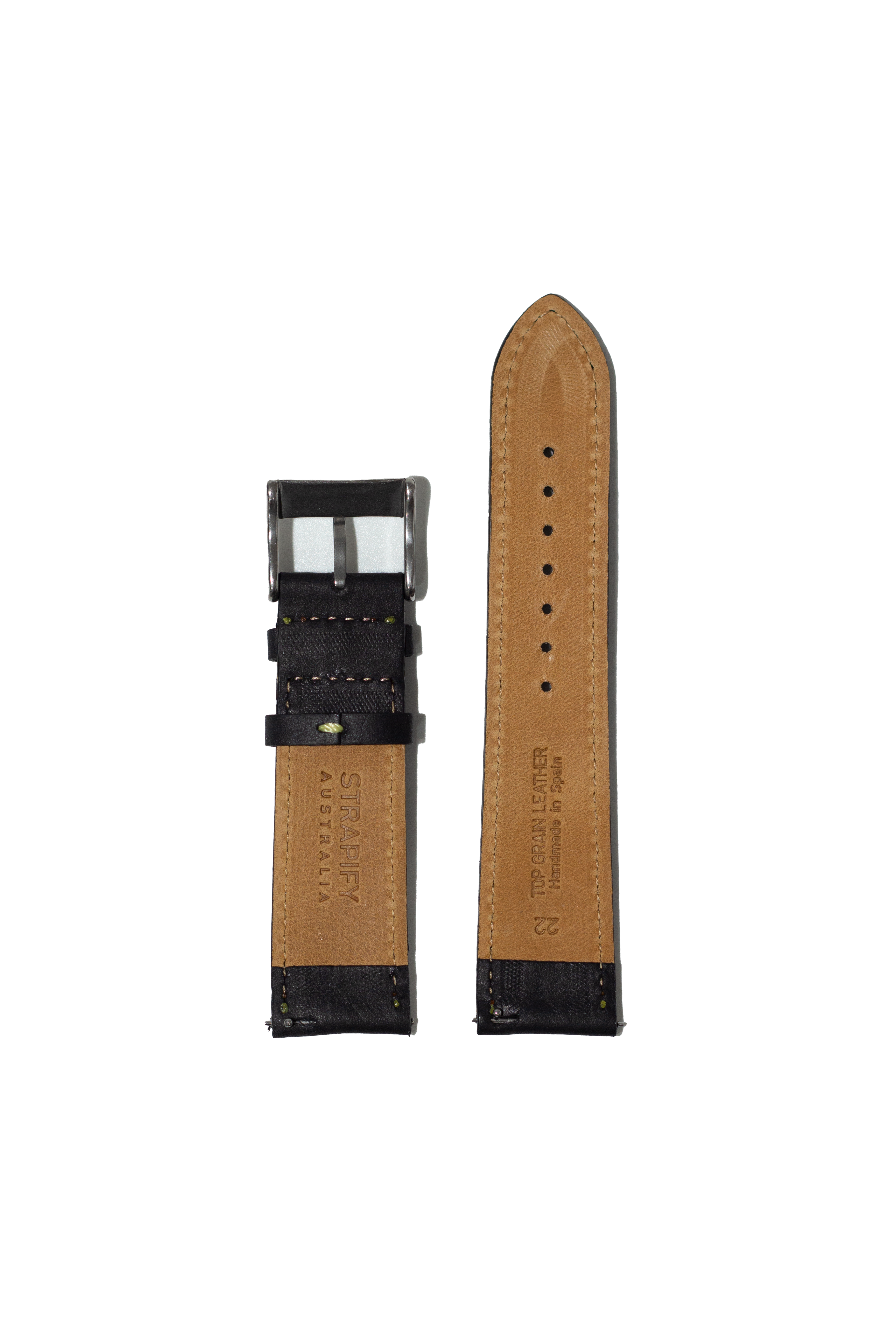 Black leather watch strap with tan backing, yellow stitching, and quick release buckle system