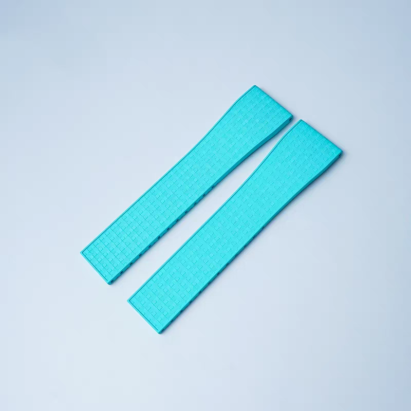 Pair of turquoise textured rubber watch straps with quick release 16mm connectors and leaf-spring deployant clasp