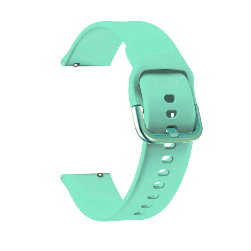 Mint green silicone smartwatch band with quick release pins and adjustable buckle closure