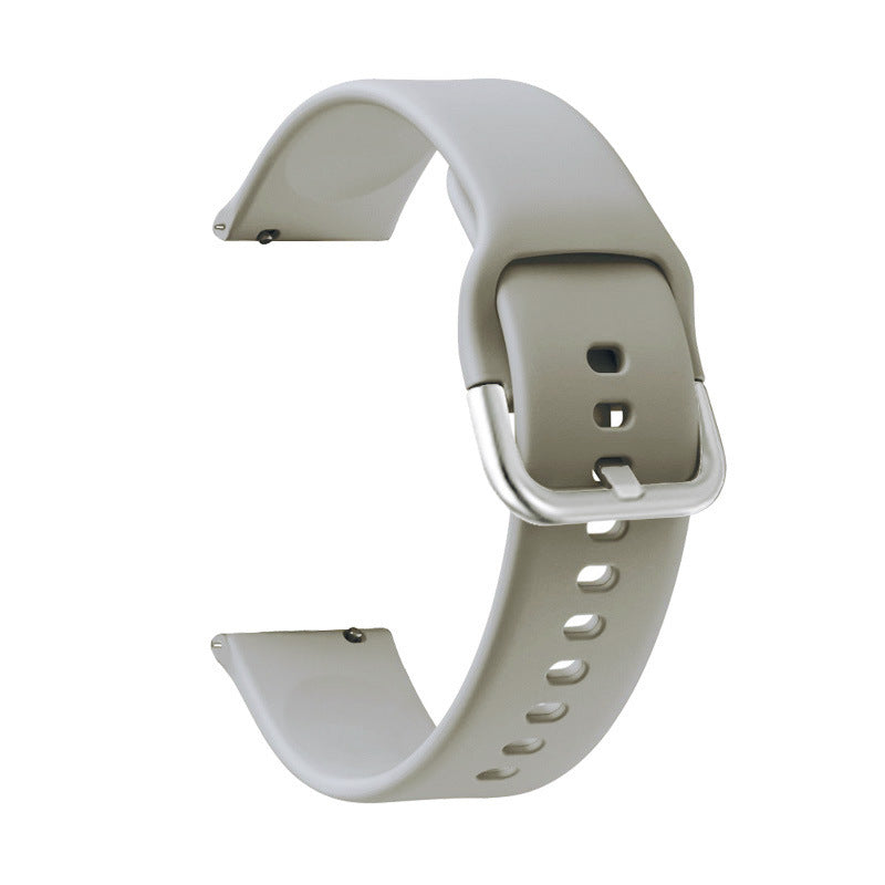Beige silicone quick release watch band with adjustable holes and metal buckle clasp