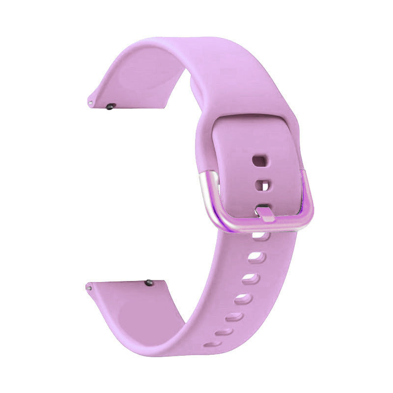 Pink silicone quick release smartwatch band with adjustable buckle clasp and ventilation holes