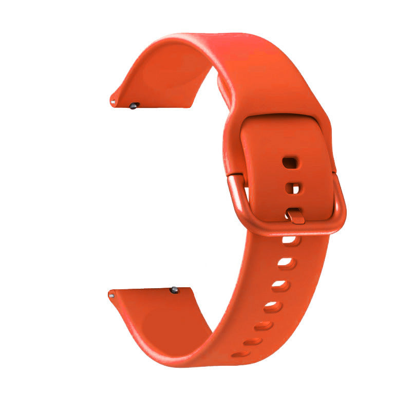 Quick release flexi silicone watch band in coral red with adjustable strap holes and buckle closure