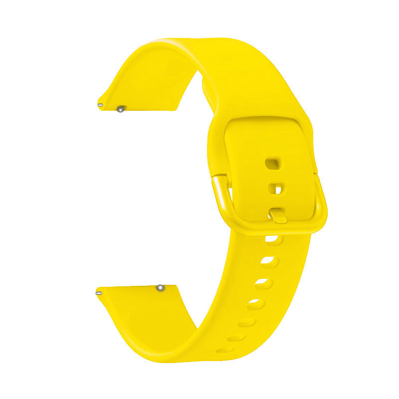 Bright yellow silicone watch band with quick release pins and ventilation holes for sports watches