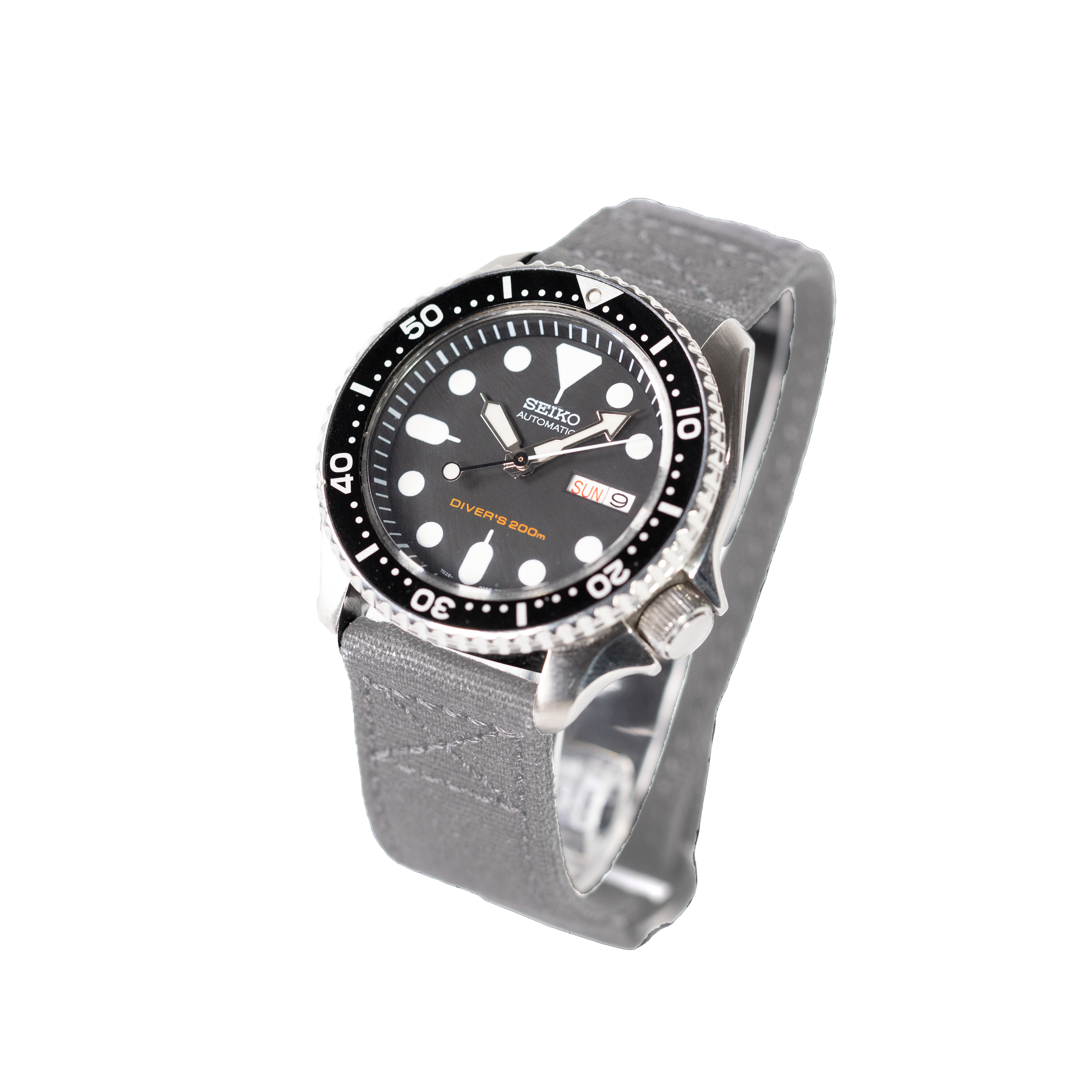 Seiko automatic diver watch with black dial, 200m water resistance, day-date window, grey fabric quick-release strap