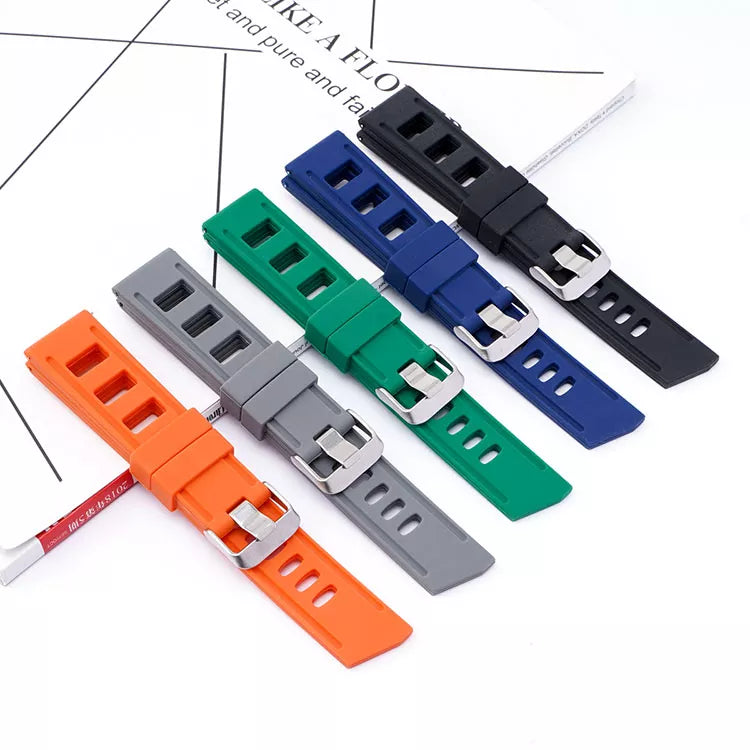Colorful quick release silicone watch bands in orange, gray, green, blue, and black with metal buckles