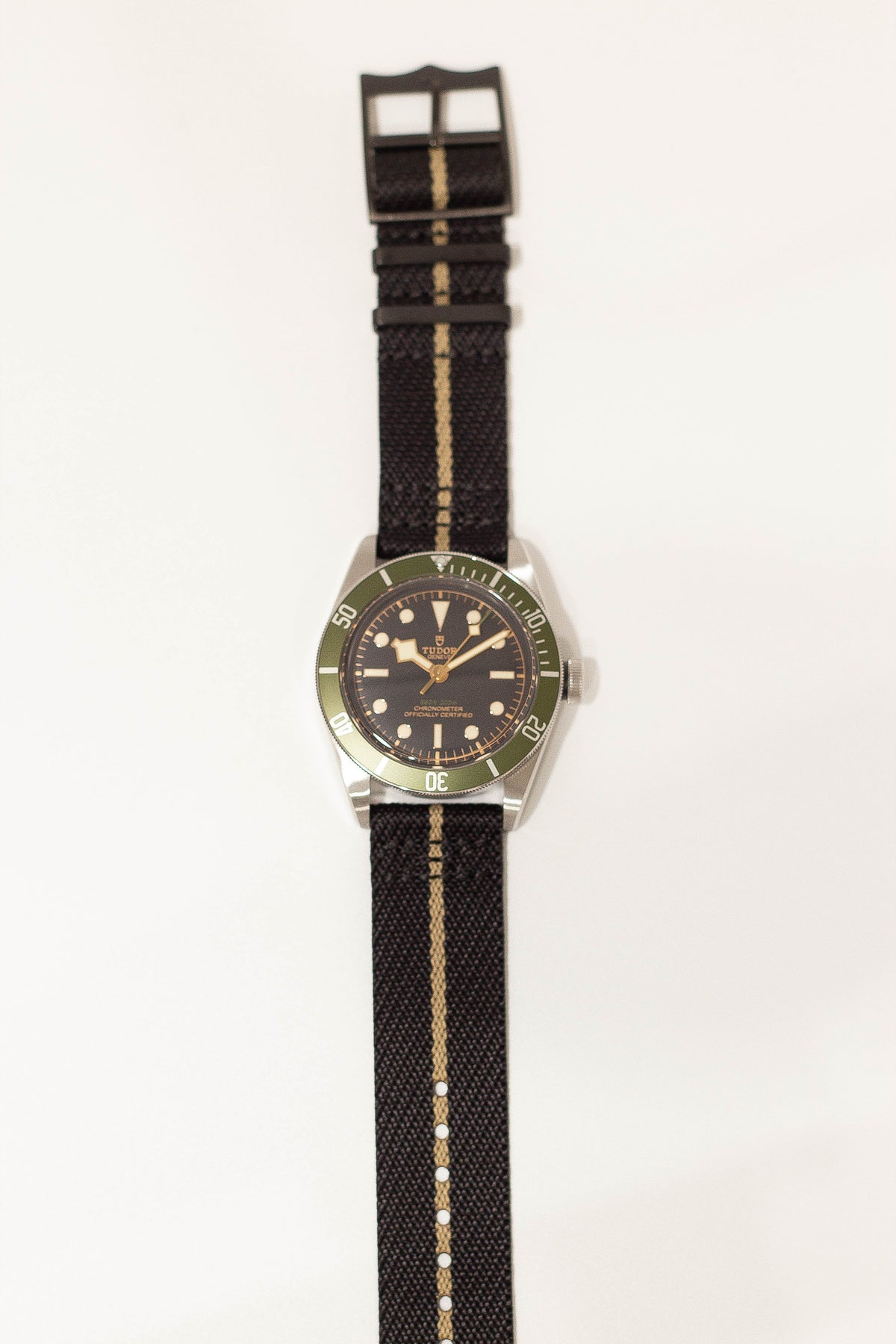 Stealth black wheat black hardware cross NATO strap on watch
