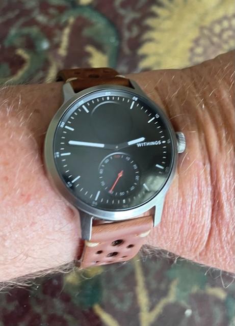 Vintage Rally brown leather watch with quick release strap worn on wrist, featuring black dial and red second hand